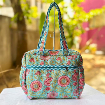 Blue Floral Quilted Handbag by Suryatra