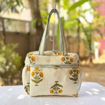 Yellow Floral Quilted Handbag by Suryatra
