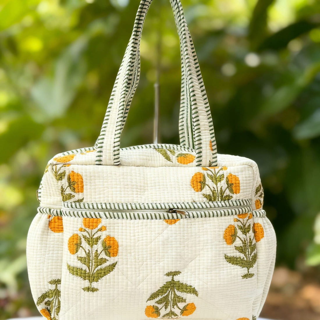 Yellow Floral Quilted Handbag by Suryatra