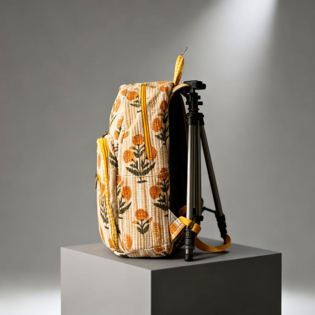 Yellow Floral Quilted Backpack by Suryatra