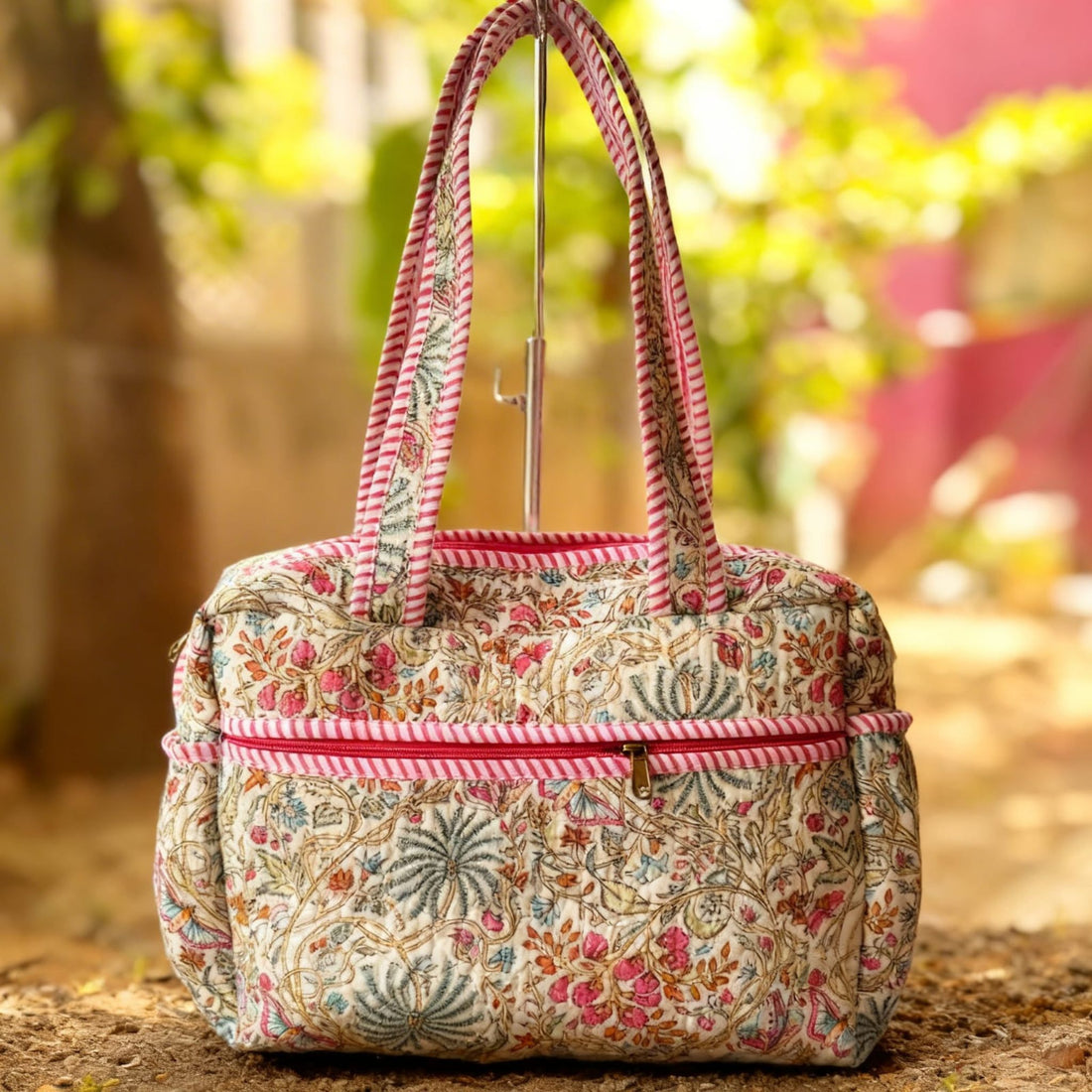 Pink Floral Quilted Handbag by Suryatra