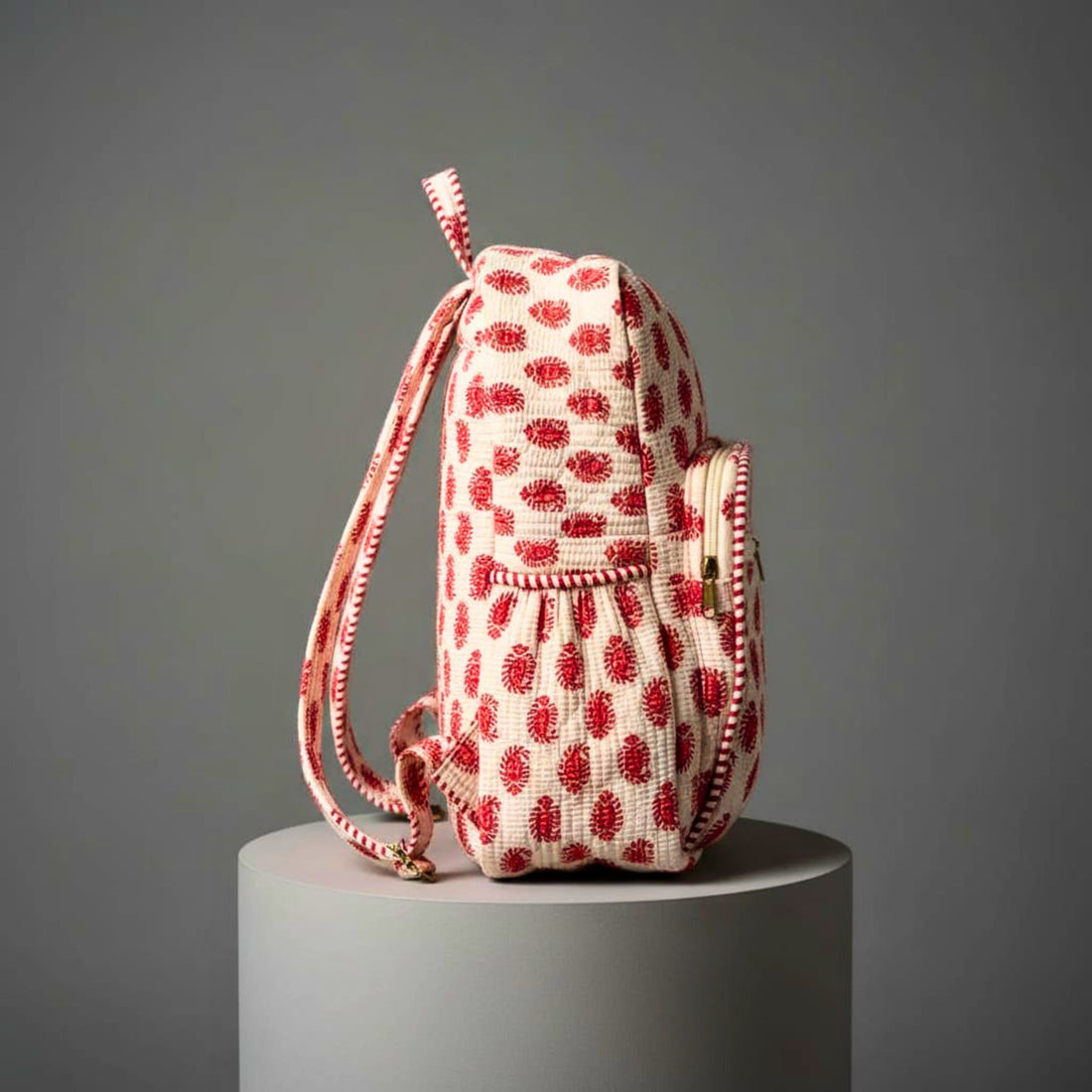 Red Ethnic Print Quilted Backpack by Suryatra